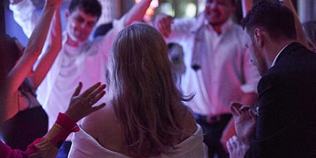 Wedding bridge and groom in front of their guests